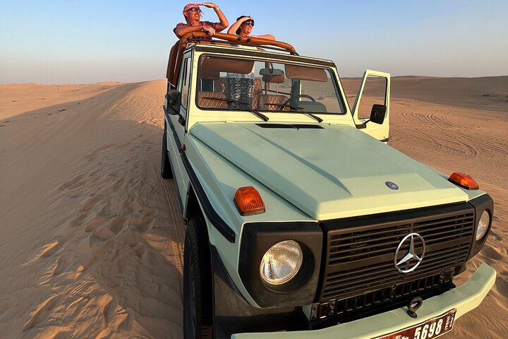 Adventure through the golden sands in a classic Mercedes soaking in the magic of the Al Marmoom Desert while connecting with Bedouin culture and savoring desert delicacies under the stars.